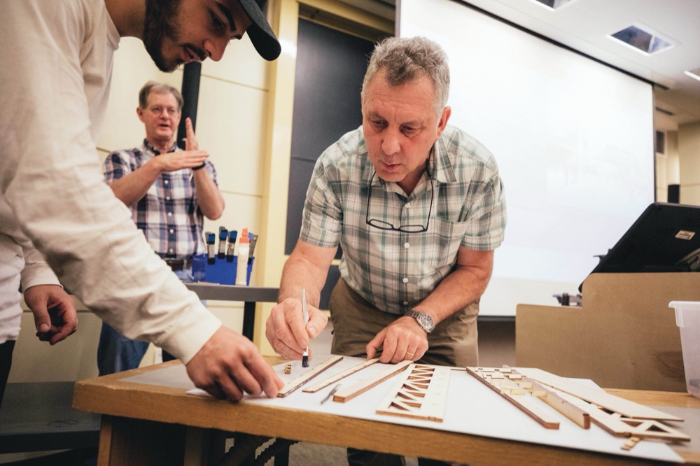 Lee Schuette works with students to show prototyping in the Mshop